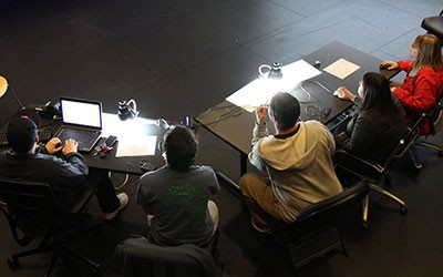 students sitting at tables viewed from above